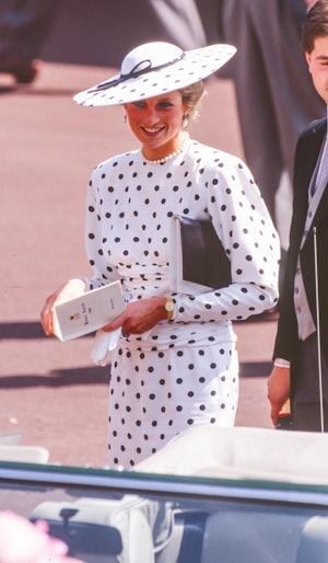 Diana, Princess of Wales wears a white polka dot dress and hat to attend The Royal Ascot race meetin...