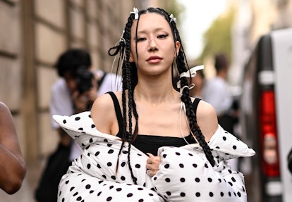 Braided ponytails are a Paris Fashion Week Spring/Summer 2024 street style beauty trend