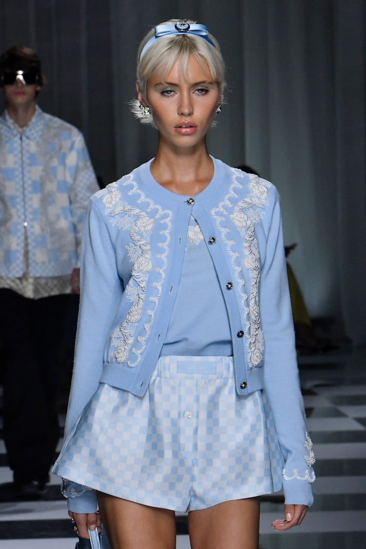 MILAN, ITALY - SEPTEMBER 22: A model walks the runway during the Versace Ready to Wear Spring/Summer...