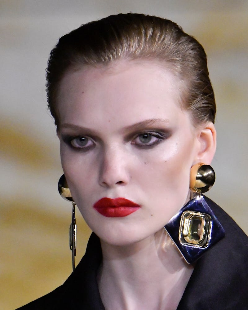 Saint Laurent model red statement lipstick at Paris Fashion Week spring/summer 2024