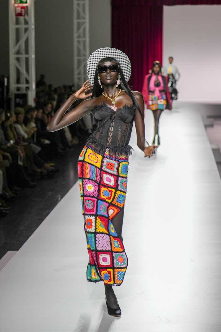 MILAN, ITALY - SEPTEMBER 21: A model walks the runway at the Moschino fashion show during the Milan ...