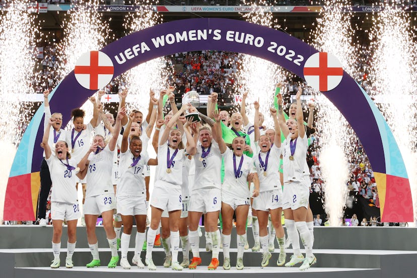 England players celebrate winning the UEFA Women's EURO 2022 Trophy after their sides victory during...