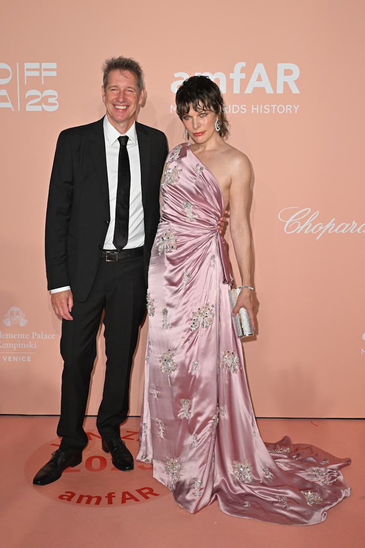 Paul W. S. Anderson and Milla Jovovich attend the amfAR Gala Venezia 2023 presented by Mastercard an...