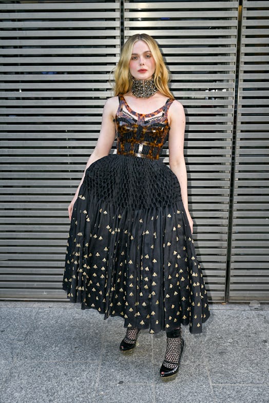Elle Fanning attends the Alexander McQueen SS24 show during Paris Fashion Week at Le Carreau du Temp...