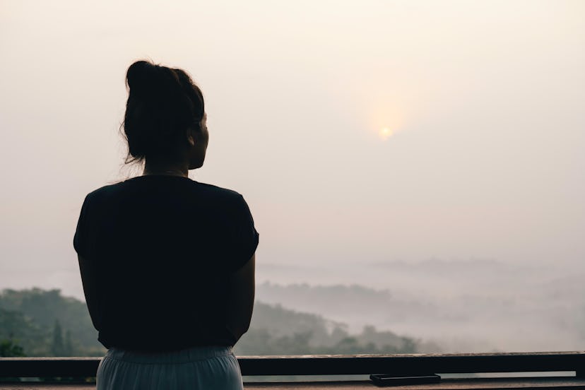 asian woman looking at view of bukit situmbu, magelang