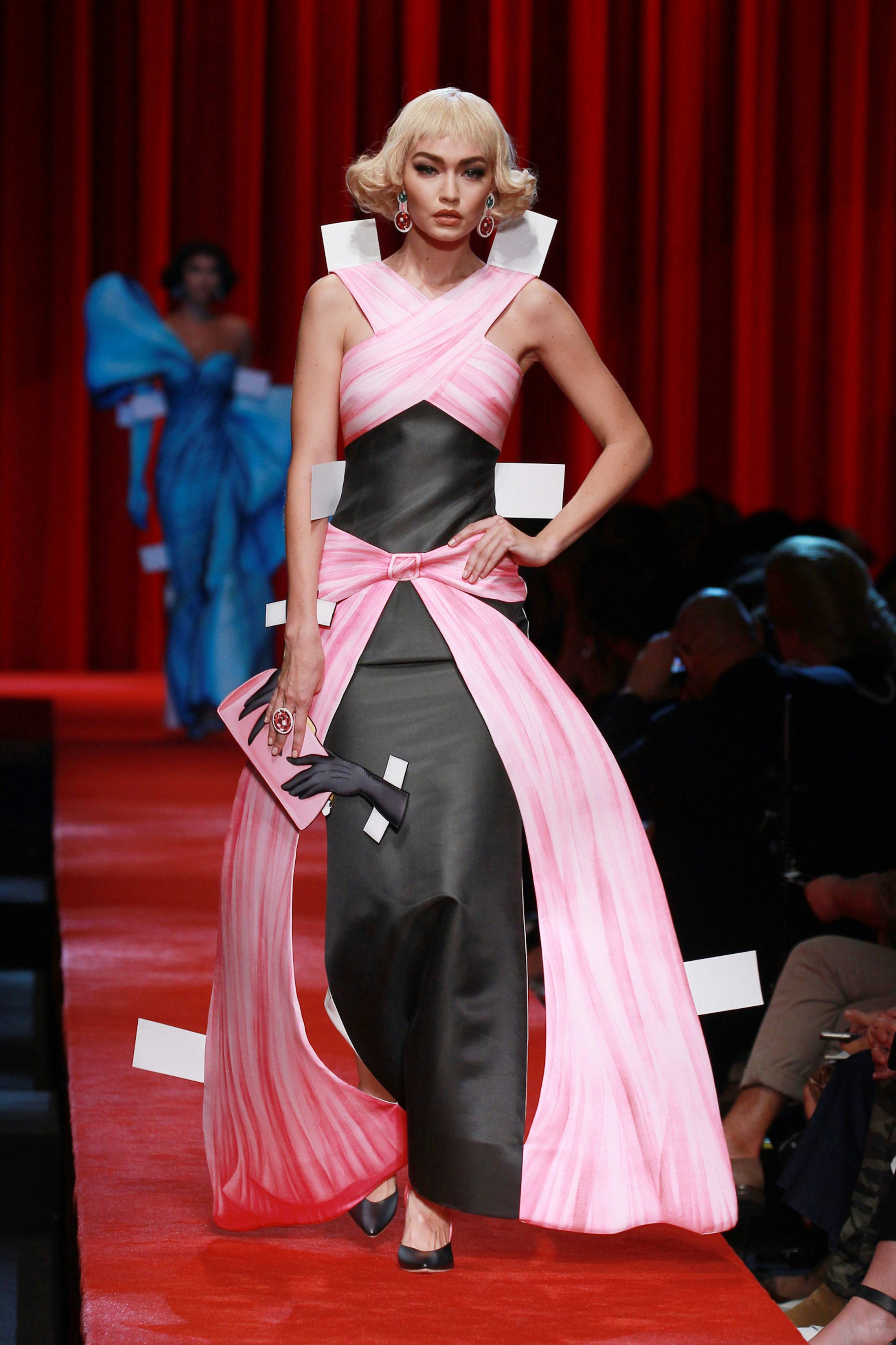 Gigi Hadid walks the runway at the Moschino show during Milan Fashion Week Spring/Summer 2017.