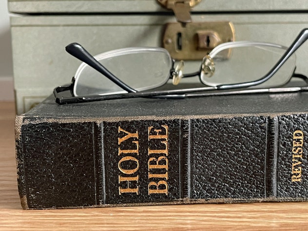 closeup of spine of holy bible in article about religions that don't celebrate halloween