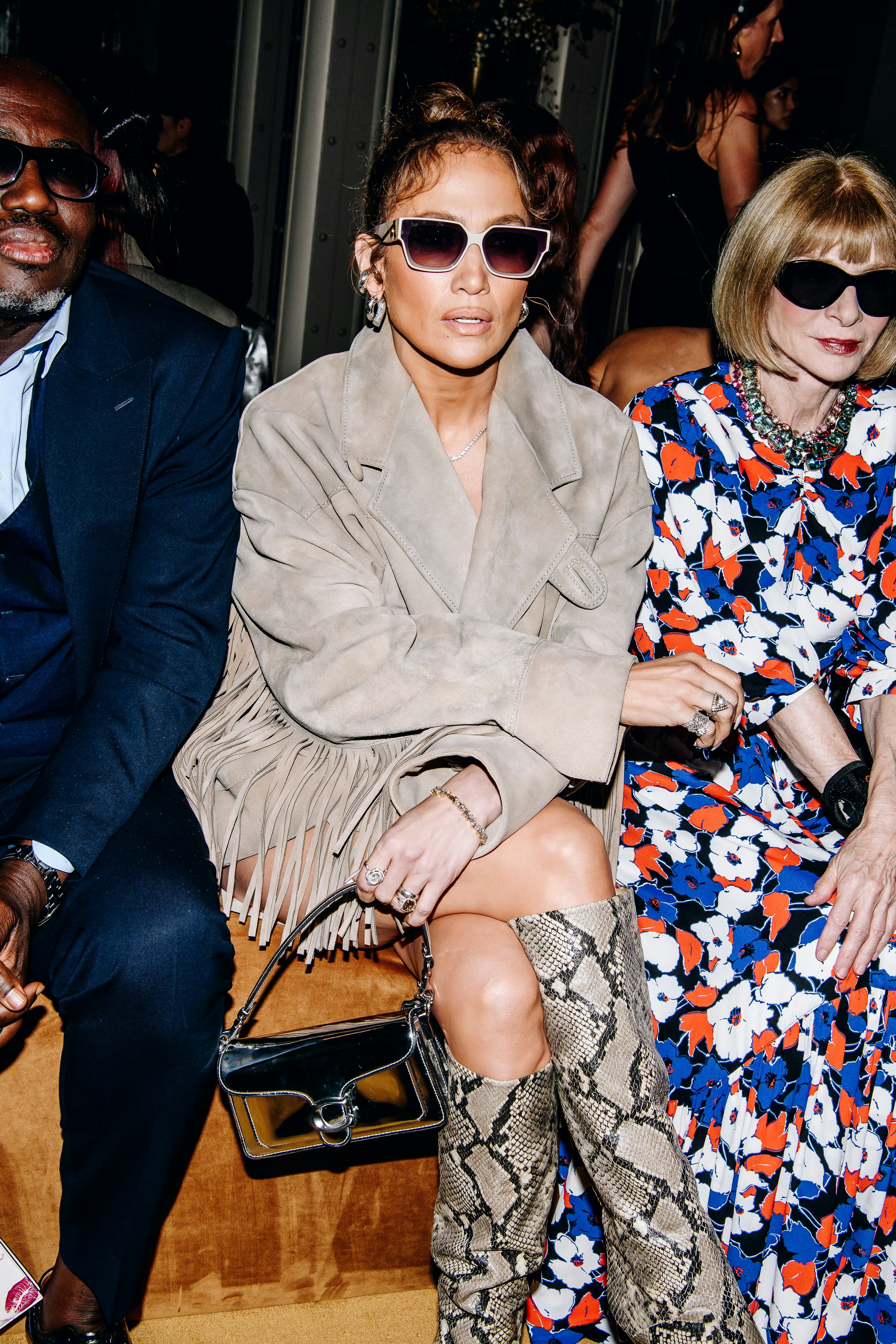 Jennifer Lopez wears a suede jacket, snakeskin boots, and a Coach Tabby bag at the COACH Spring 2024&hellip;