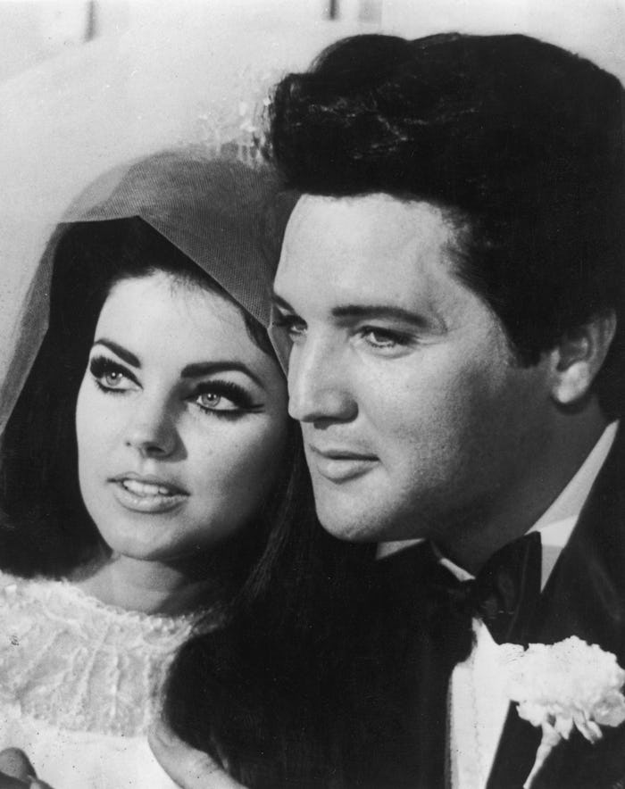 1st May 1967:  American rock n' roll singer and actor Elvis Presley (1935 - 1977) with his bride Pri...