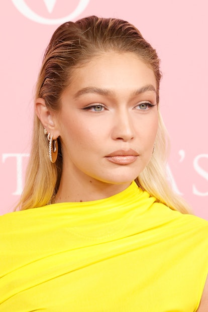 Gigi Hadid grown out roots and slicked down hairstyle at NYFW 2023 