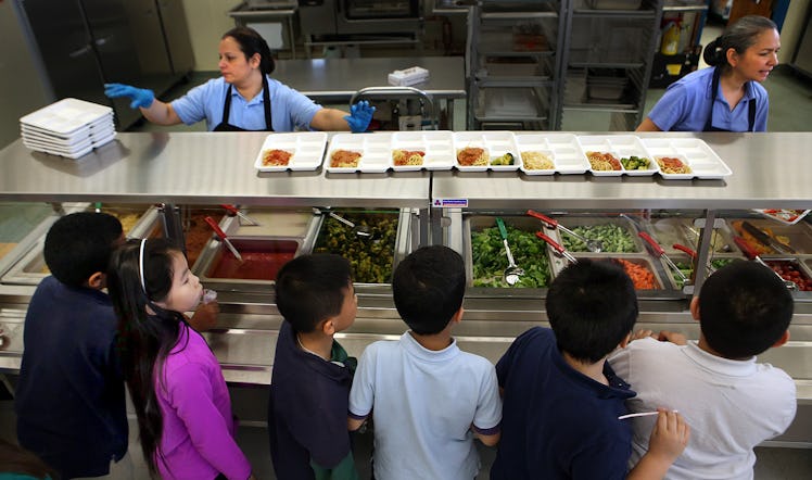 (011118 Boston, MA) Students wait in line for lunch during the nutrition program at Bradley Elementa...