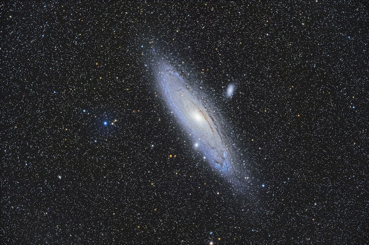 The well-known Andromeda Galaxy, Messier 31, with its companion galaxies. M32, below it and seemingl...
