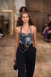 Model on the runway at the Ralph Lauren Spring 2024 Ready To Wear Fashion Show at the Brooklyn Navy ...