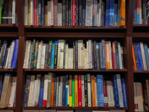Bookshelves filled with rows of books at home, defocused for use as texture or background