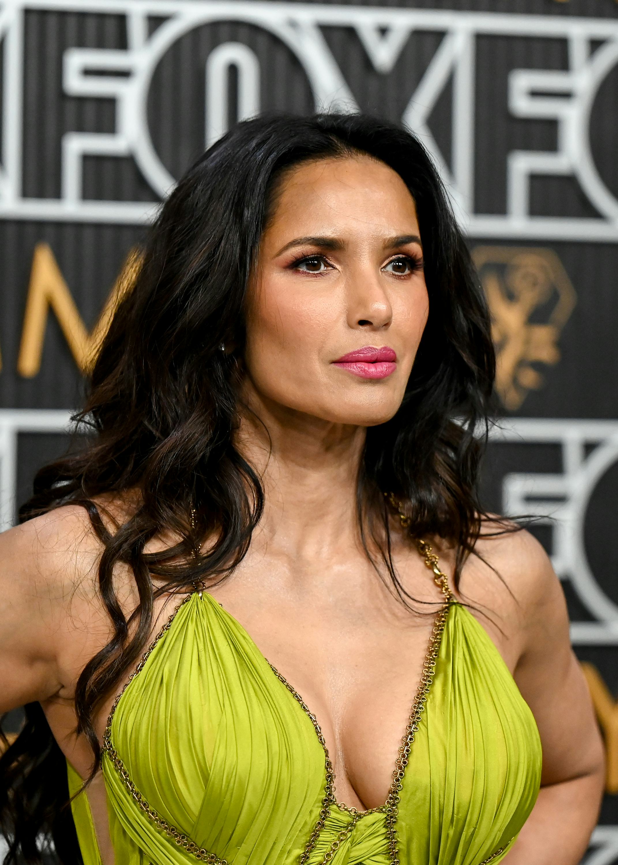 Padma Lakshmi wore bold fuchsia lipstick at the 2024 Emmy Awards.