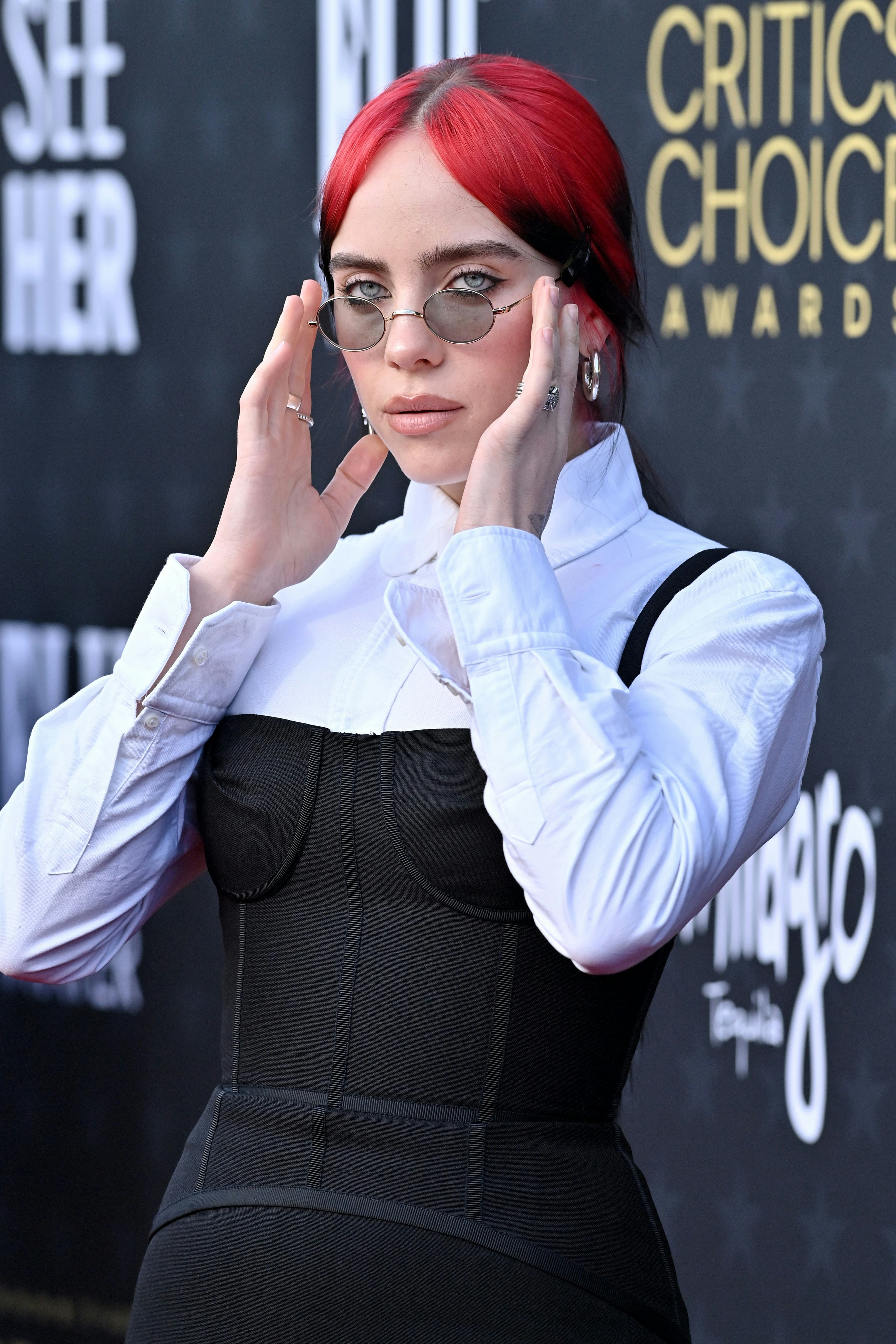 Billie Eilish wears a bustier little black dress to the 2024 Critics Choice Awards.
