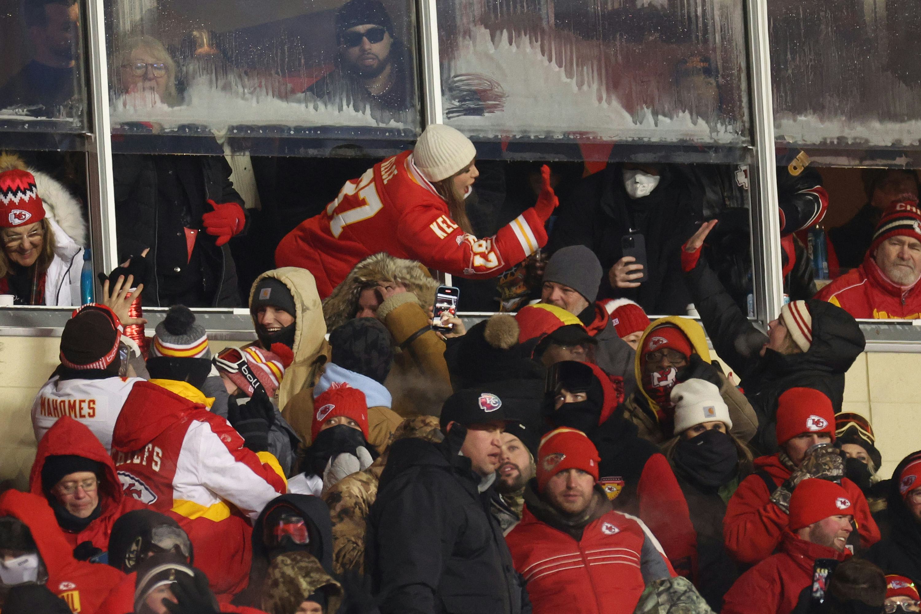 Taylor Swift celebrates with Kansas City Chiefs fans.