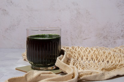 Blue-green algae Chlorella and spirulina powder drink. Super powder. Natural supplement of algae. De...