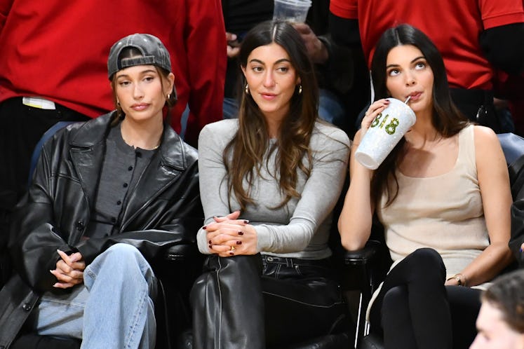 Hailey Bieber, Sarah Staudinger and Kendall Jenner attend a basketball game between the Los Angeles ...