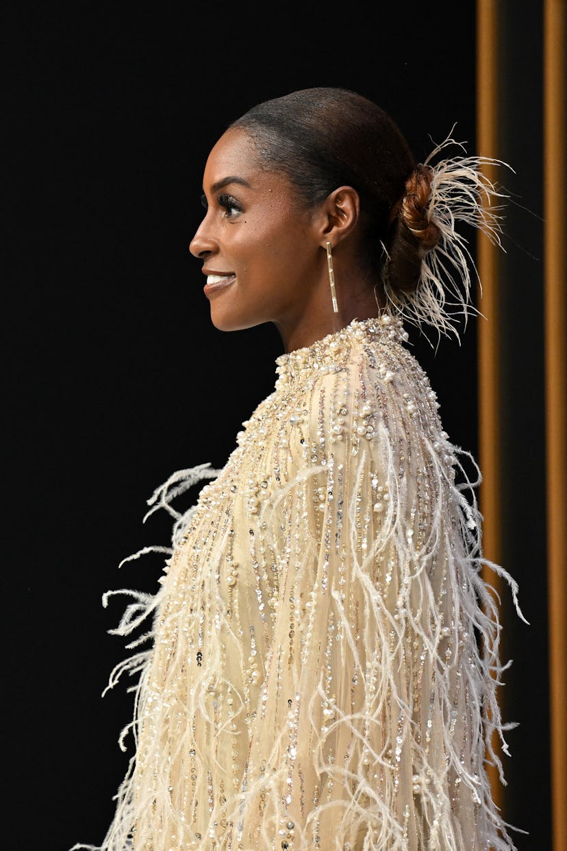 Issa Rae wore feathers in her slicked-back bun at the 2024 Emmy Awards.
