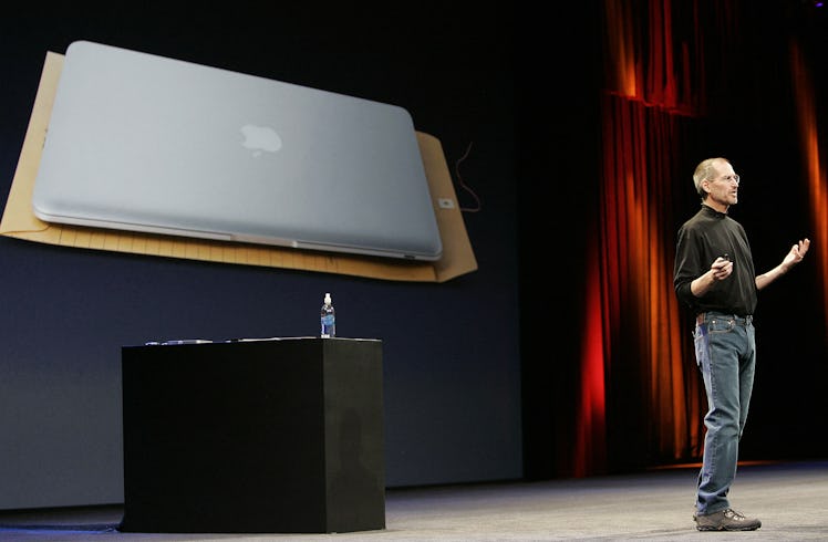 Apple CEO and co-founder Steve Jobs shows off the new Macbook Air ultra portable laptop during his k...