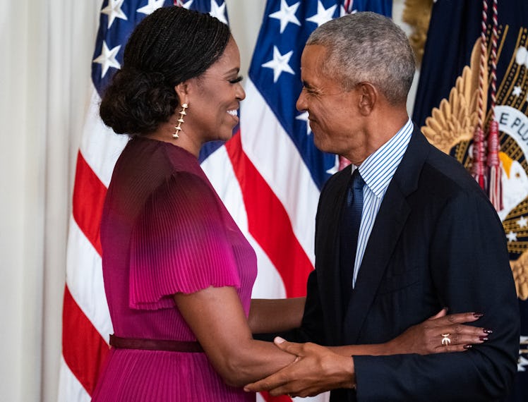 Former President Barack Obama and former First Lady Michelle Obama attend their official White House...