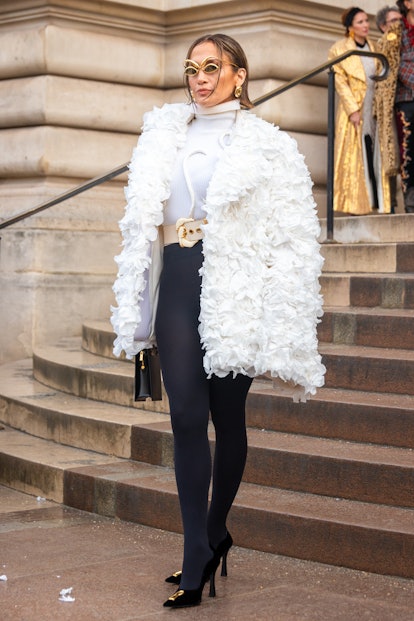 Jennifer Lopez attends the Schiaparelli Haute Couture Spring/Summer 2024 show in Paris in a white co...