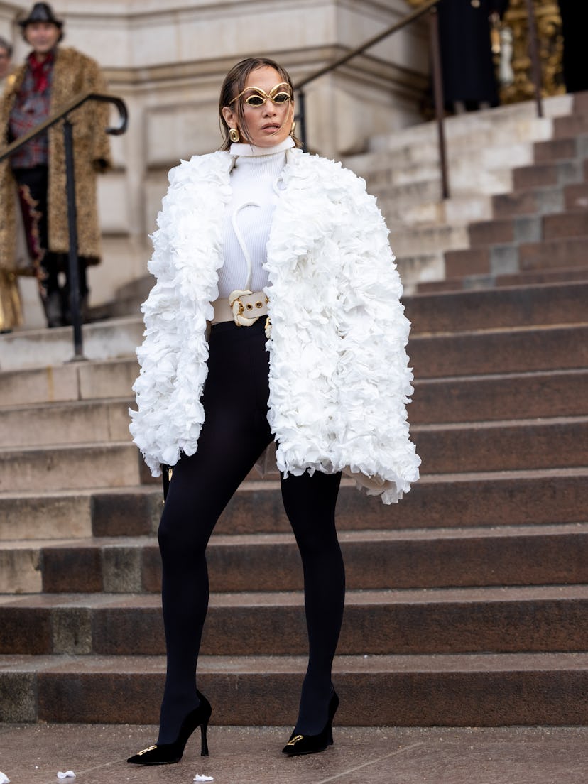 Jennifer Lopez attends the Schiaparelli Haute Couture Spring/Summer 2024 show in Paris in a white co…