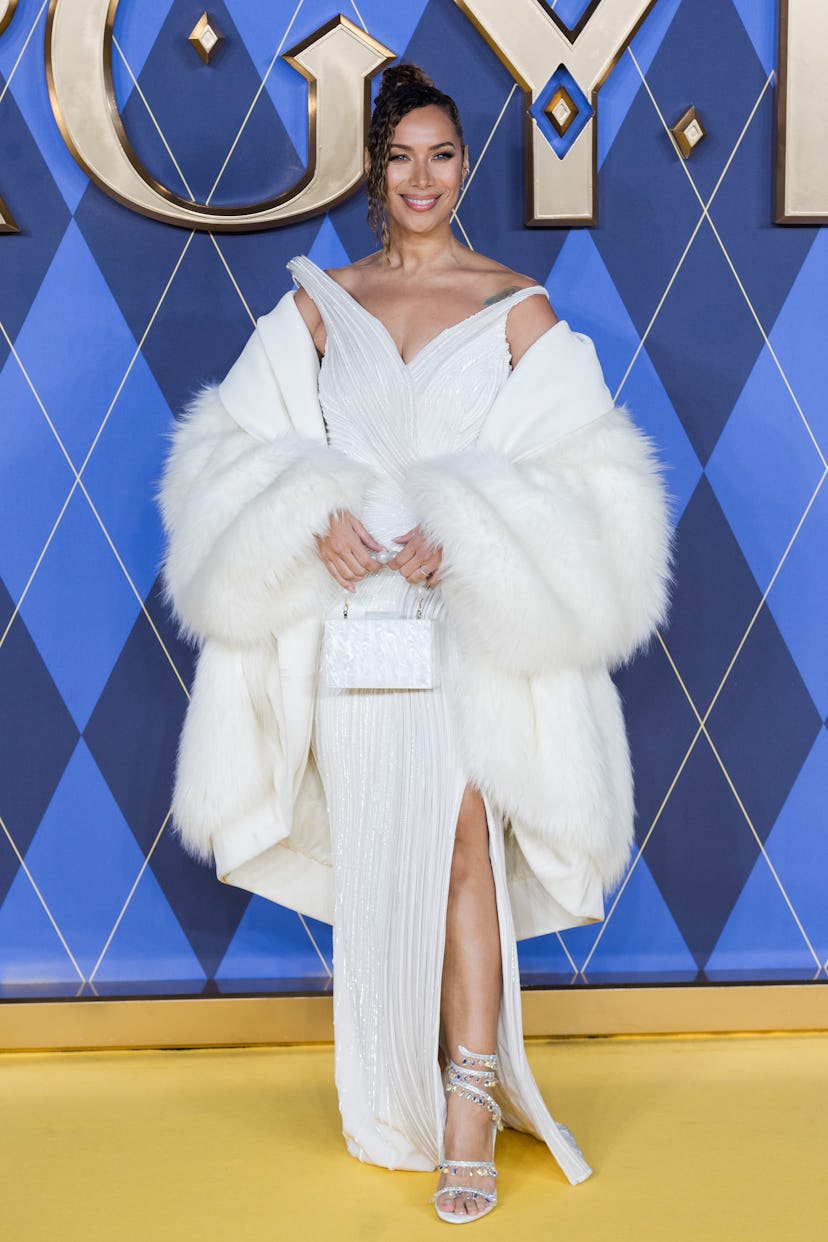 leona lewis wears a white off-the-shoulder gown and a fur coat at the argylle world premiere