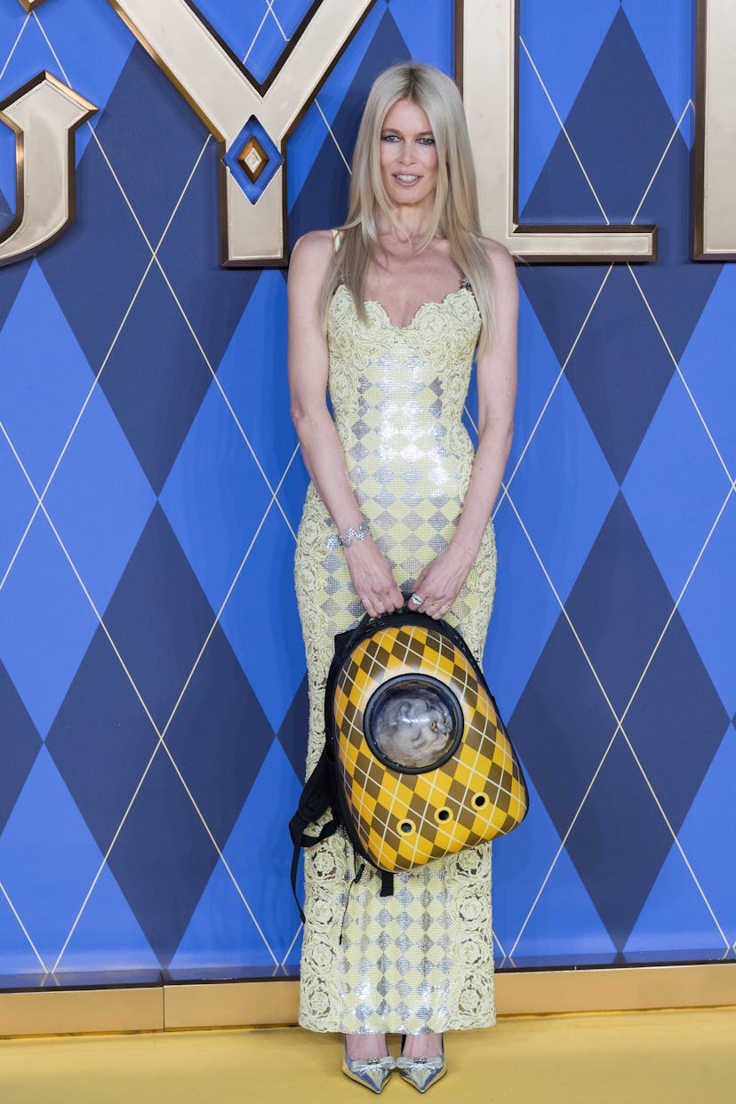 claudia schiffer wears a versace pastel yellow gown at the argylle world premiere
