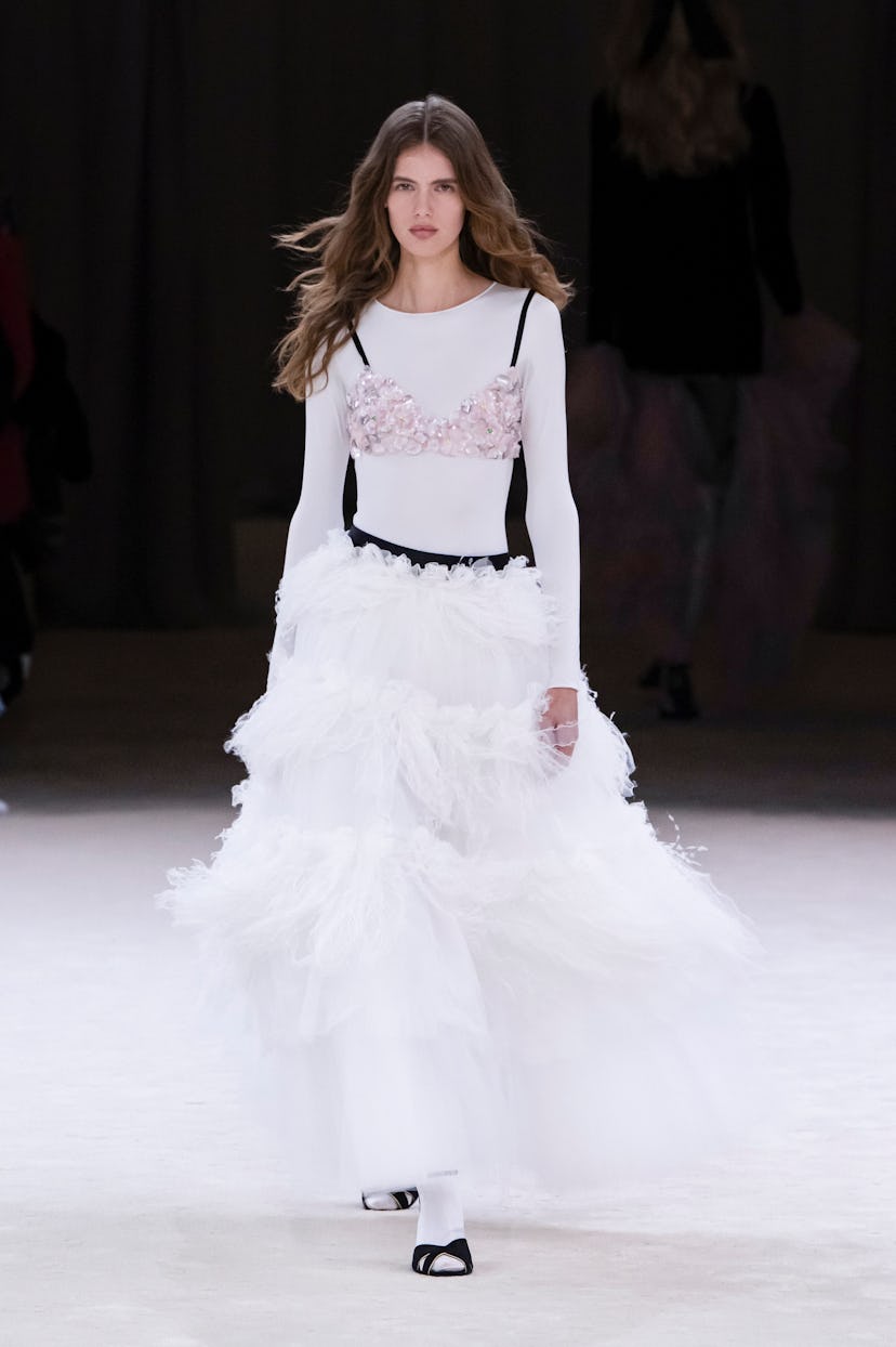 A model walks the runway during the Chanel Haute Couture Spring/Summer 2024 in a sequin bra