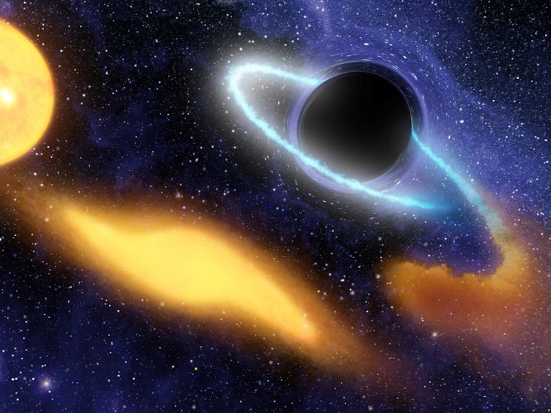 Supermassive black hole at the center of a remote galaxy digesting the remnants of a star. (Photo by...