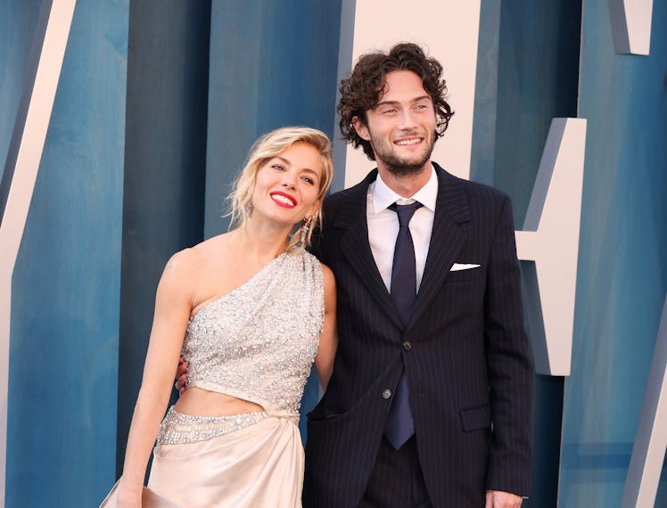 Sienna Miller and Oli Green attend the 2022 Vanity Fair Oscar Party hosted by Radhika Jones at Walli...