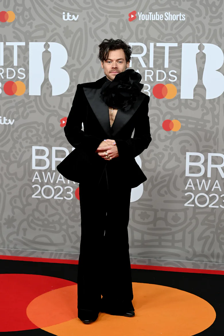 harry styles dress red carpet Harry Styles' Grammy fashion: Rainbow jumpsuit divides social media
