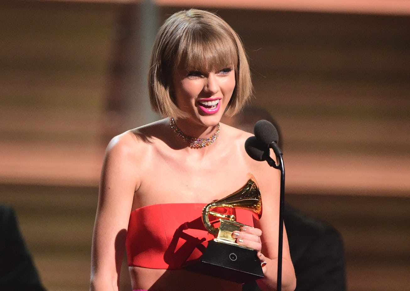 Singer Taylor Swift accepts the award for the Album of the Year onstage during the 58th Annual Gramm...