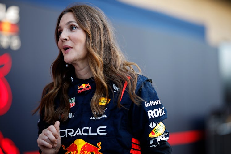 AUSTIN, TEXAS - OCTOBER 19: Drew Barrymore wears Oracle Red Bull Racing team overalls in the Paddock...