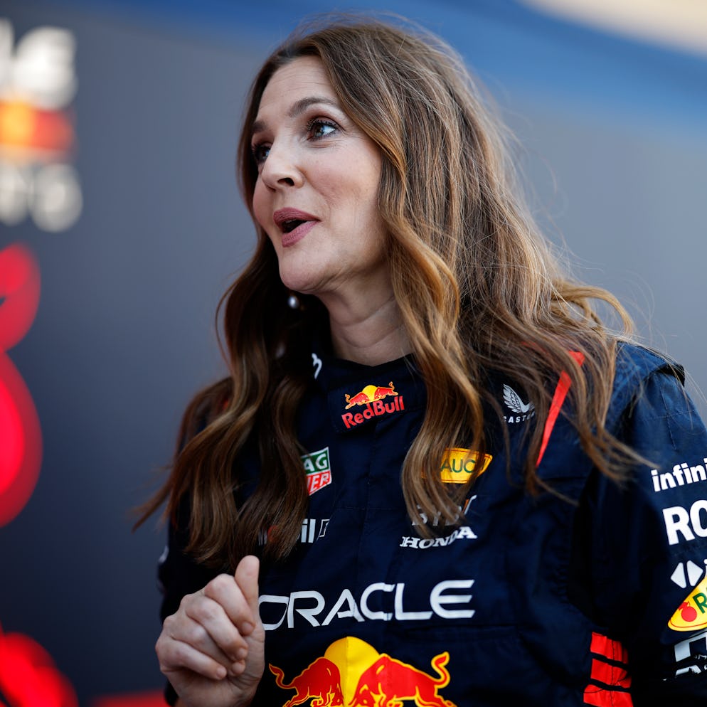 AUSTIN, TEXAS - OCTOBER 19: Drew Barrymore wears Oracle Red Bull Racing team overalls in the Paddock...