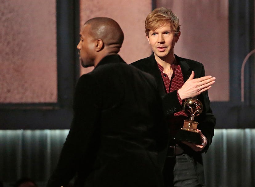 LOS ANGELES, CA - February 8, 2015 Kanye West avoids contact with an inviting Beck after Beck won Al...