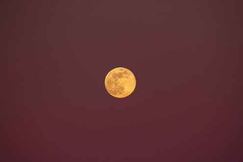Wolf moon rising in a purple sky is seen from Tornimparte (L'Aquila), Italy, on January 25th, 2024. ...