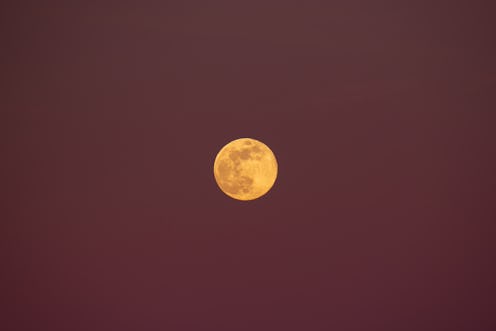Wolf moon rising in a purple sky is seen from Tornimparte (L'Aquila), Italy, on January 25th, 2024. ...