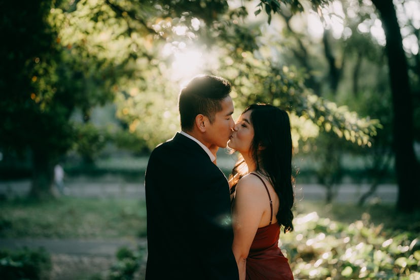 Young couple having a romantic moment in a park at sunset, Tokyo