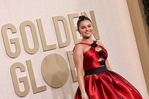 Selena Gomez attends the 2024 Golden Globe Awards in a red high-low cut-out dress