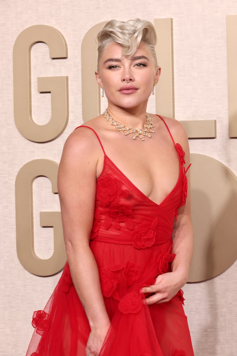 Florence Pugh walked the Golden Globes 2024 red carpet in a see-through red dress that freed the nip...