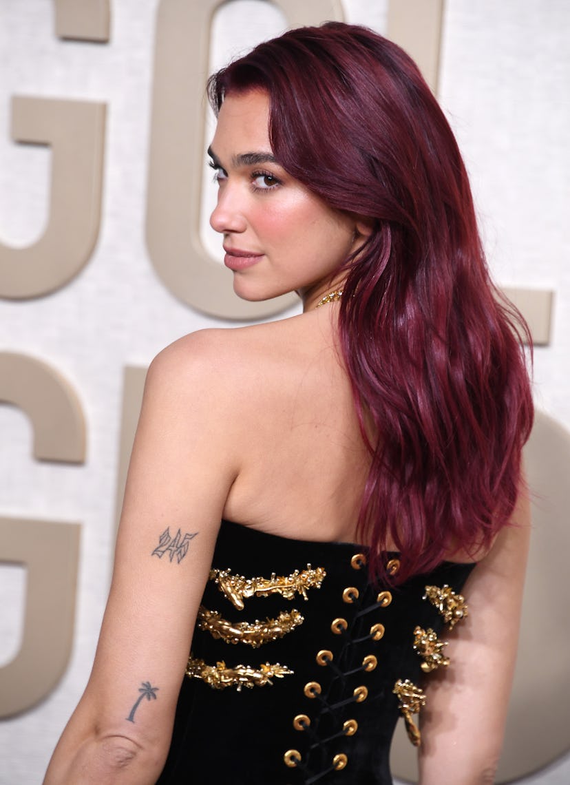 Dua Lipa with cherry coke hair.