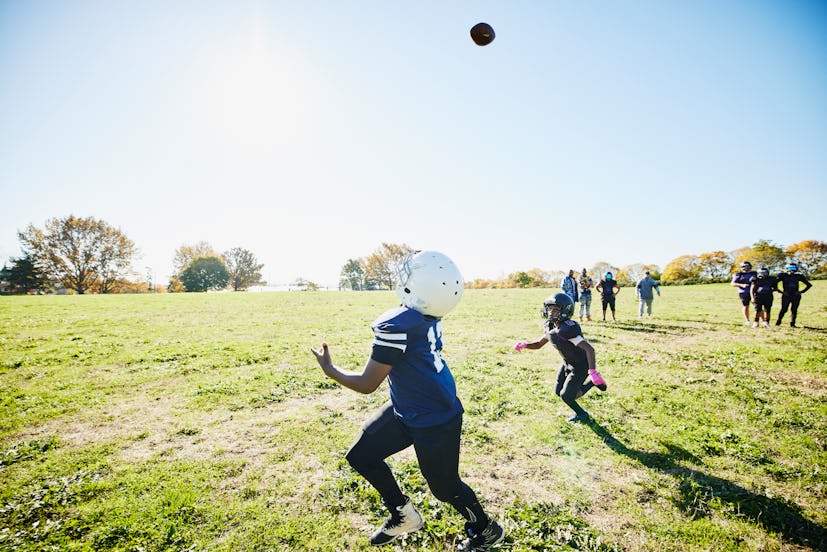 Kids playing American football in a story answering the question, how old does your kid have to be t...