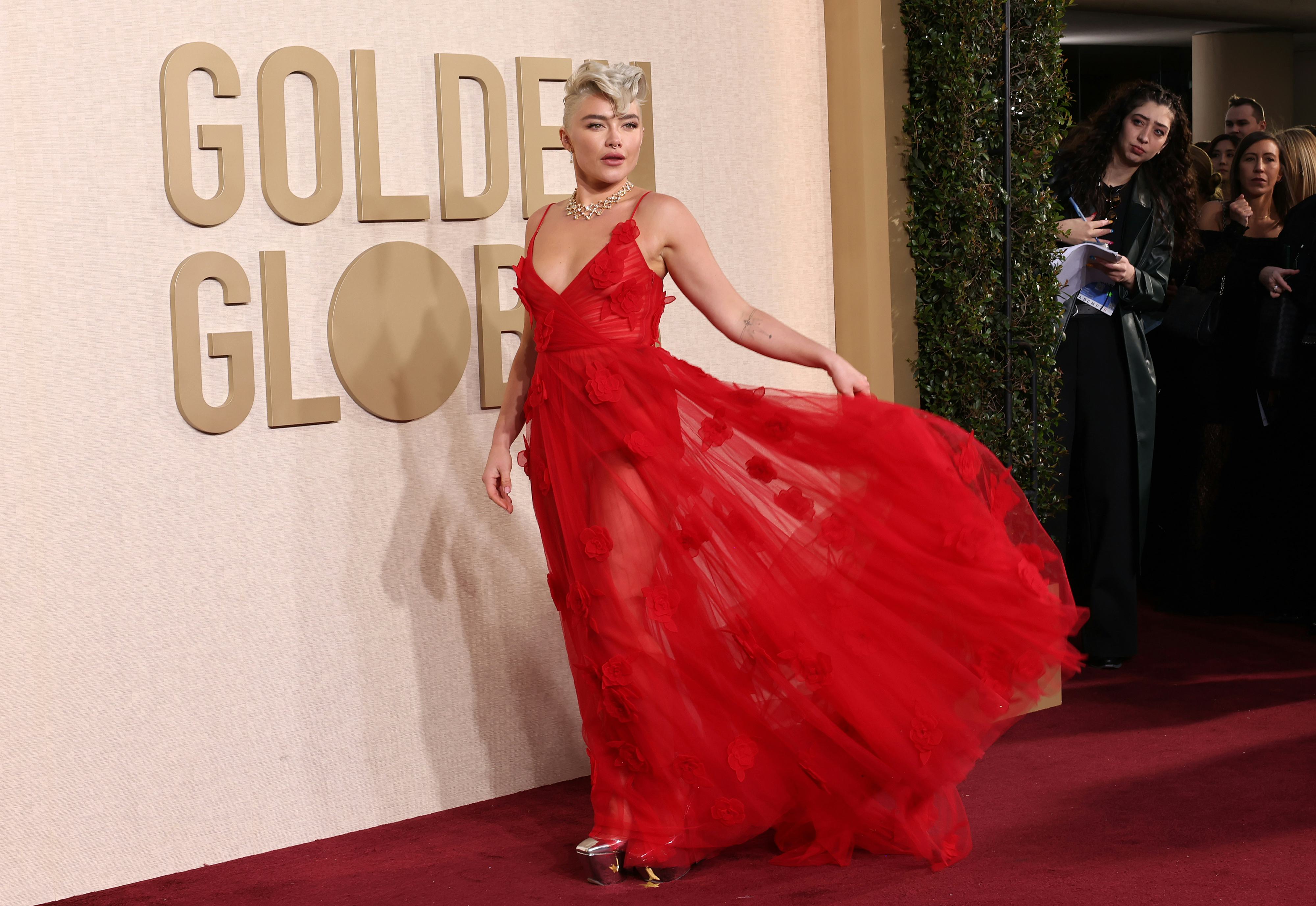 Florence Pugh walked the Golden Globes 2024 red carpet in a see-through red dress that freed the nip&hellip;