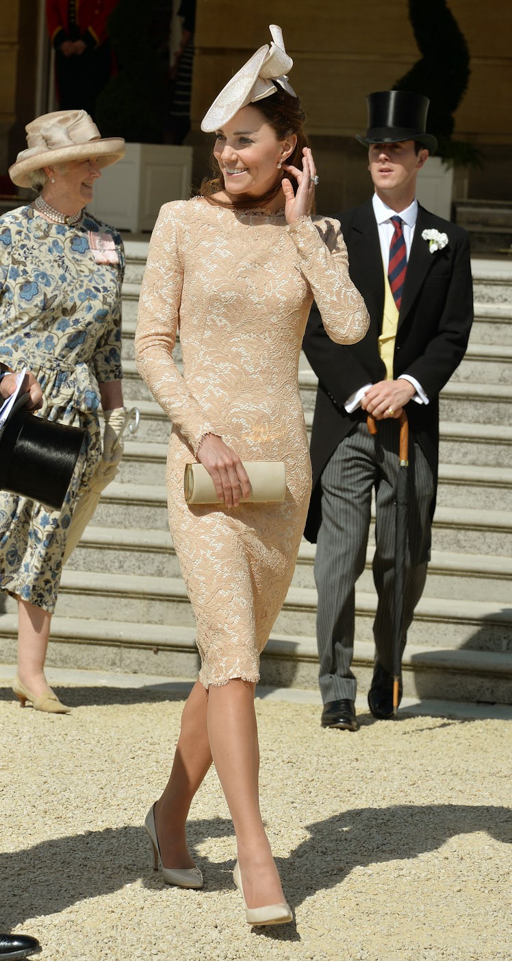 Britain's Catherine, Duchess of Cambridge, meets guests at a garden party held at Buckingham Palace,