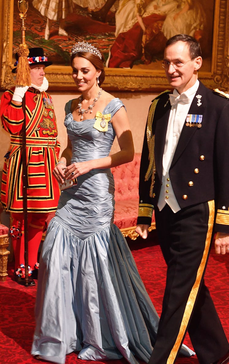 Britain's Catherine, Duchess of Cambridge, (L) walks with Rear Admiral Ludger Brummelaar 