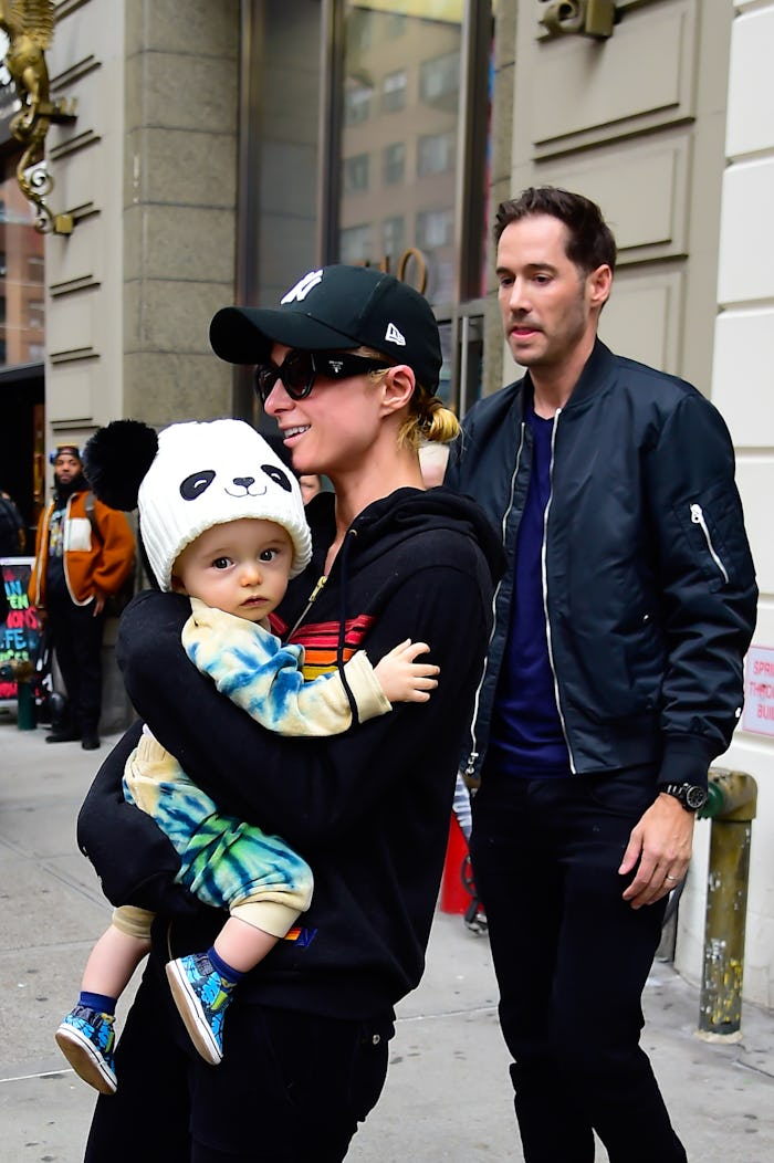 NEW YORK, NEW YORK - OCTOBER 18:(L-R) Paris Hilton, Carter Reum, and their son Phoenix Barron Hilton...