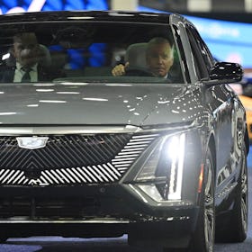 US President Joe Biden sits at the wheel of a Cadillac Lyriq electric vehicle as he visits the 2022 ...